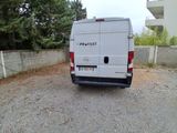 a white van that is parked on the side of the road