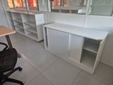 an office with a desk and a chair in it