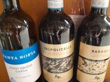 three bottles of wine are sitting on a table in front of a box