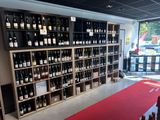 many bottles of wine on the shelves in the store