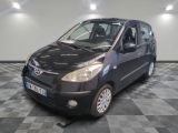a picture of a small black car on a checkered floor
