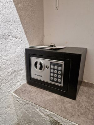 a small safe box sitting on a counter in a room