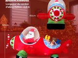 une décoration de Noël gonflable représentant le Père Noël aux commandes d'un petit avion