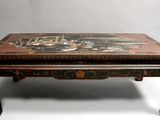 an image of a table with a painting on the top of it