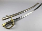 a close up of a pair of swords on a white surface