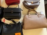 many bags on a table with price tags on them
