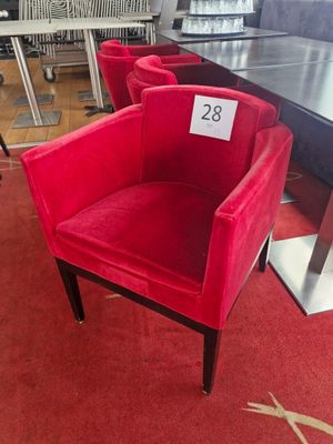 a red chair that has a price tag on it