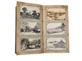 an old book opened to show pictures of a village