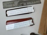 three different types of rulers and a ruler on a table