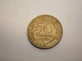 a coin that is sitting on a white surface