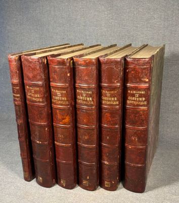 a set of five old books sitting on top of each other