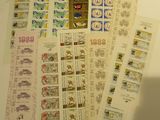 a lot of different stamps on the wall next to each other