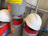three propane gas cylinders stacked on top of each other
