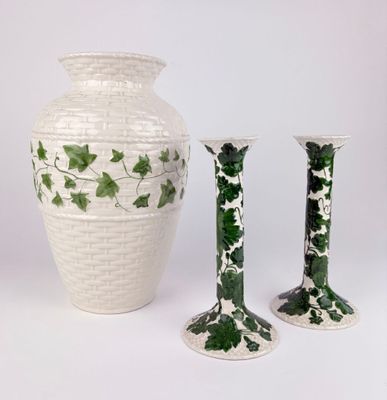 three vases sitting next to each other on a white surface