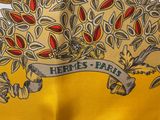a yellow scarf with a picture of a tree on it