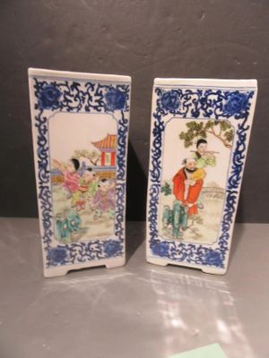 pair of blue and white porcelain vases with asian figures