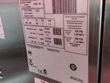 a label on the side of a stainless steel refrigerator
