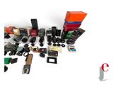 many different types of cameras and accessories on the table