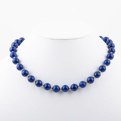 a blue beaded necklace on a mannequin mannequin mannequin mannequin mannequin mannequin mannequin mannequin mann