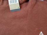 a brown hoodie with a tag on the back of it