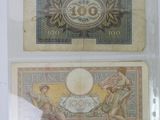 two different types of bank notes on display in a glass case