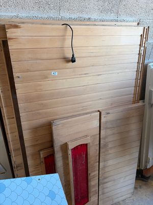several pieces of wood are stacked on top of each other in a room