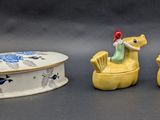 three figurines that are sitting next to each other
