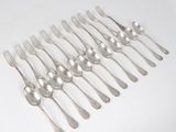a lot of silver spoons and forks on the table