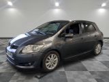 a picture of a grey toyota yaris parked in a garage