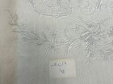 a piece of white fabric with a design on it