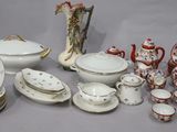 many different types of porcelain dishes and bowls on the table
