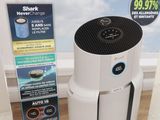 an air purifier in a box on a wooden floor
