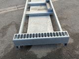 an image of a flatbed trailer with a ramp attached