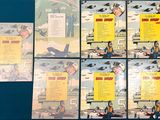 many cards with pictures of people on them on a blue surface