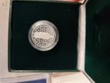 a picture of a silver coin in a box