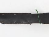 a knife that is laying on a white surface