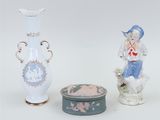 two vases and a box sitting next to each other