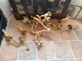 a picture of a pair of gold candles on the floor