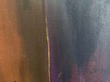 a close up of a painting of a woman ' s face on a wooden table