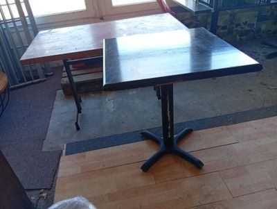 a black table with a black top in a room
