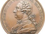 an image of a bronze medal of a man with a long hair