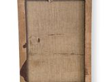 a close up of a picture frame with a piece of paper on it