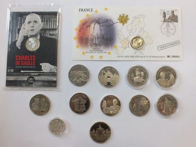 a lot of coins and a postcard on a table