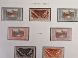 a close up of a sheet of stamps with different designs on them
