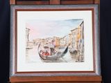 framed watercolor painting of a gondola on a wooden easel
