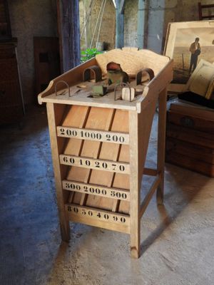 a wooden table with a lot of drawers on top of it