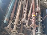 a pile of pipes and pipes sitting on the ground
