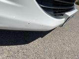 a close up of a car ' s front bumper and grille