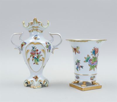 pair of vases decorated with flowers and birds on a stand