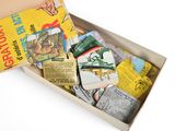 a box full of old children ' s books on a white surface